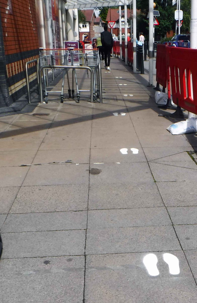 NWHistGraffiti's tweet photo. @Viral_Archive a new sign in Sale town centre (Trafford) a reminder that Corona is by no means over. The old distance indicators outside the supper market have faded to be replaced by sprayed on feet. #ViralShadows https://t.co/HVQXHlrMjC
