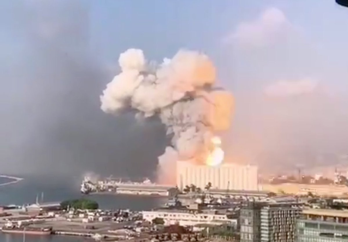 looking at some other angles it is clear that the silos were destroyed by the explosion and the origin is the warehouse looking thing in front of itthere’s also some weird shit in the air shortly before the explosion