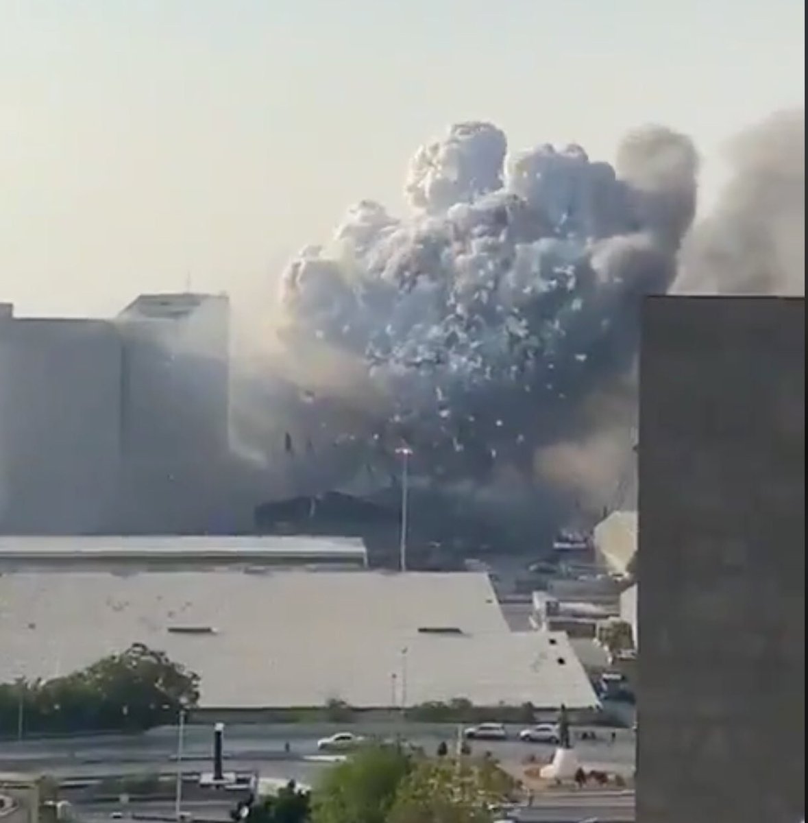 looking at some other angles it is clear that the silos were destroyed by the explosion and the origin is the warehouse looking thing in front of itthere’s also some weird shit in the air shortly before the explosion