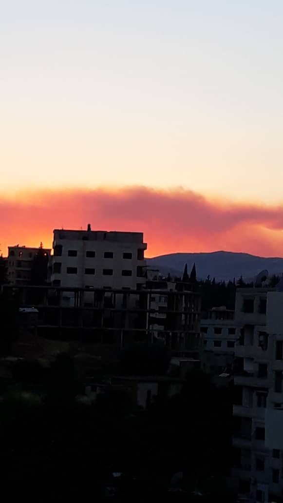 ibnabitareq's tweet photo. Photo taken by a relative in Syria about two hours away from Beirut. The sky is red from the explosion, not the sunset (which was behind the camera). Lebanon was already in a tragic state, Allah have mercy on everyone affected and give them comfort and peace. https://t.co/PHXa7CwRPP