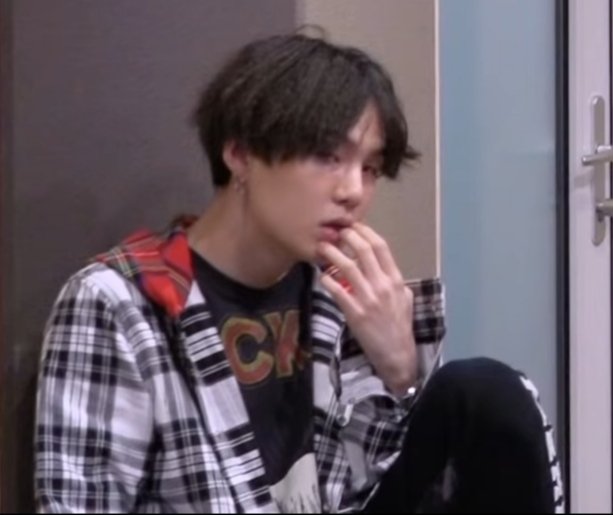 Yoongi touching his lips; a thread