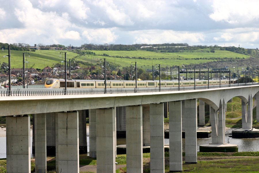 A full length (3 capitals) TMST is 387 metres long. 2 power cars plus 18 passenger vehicles.