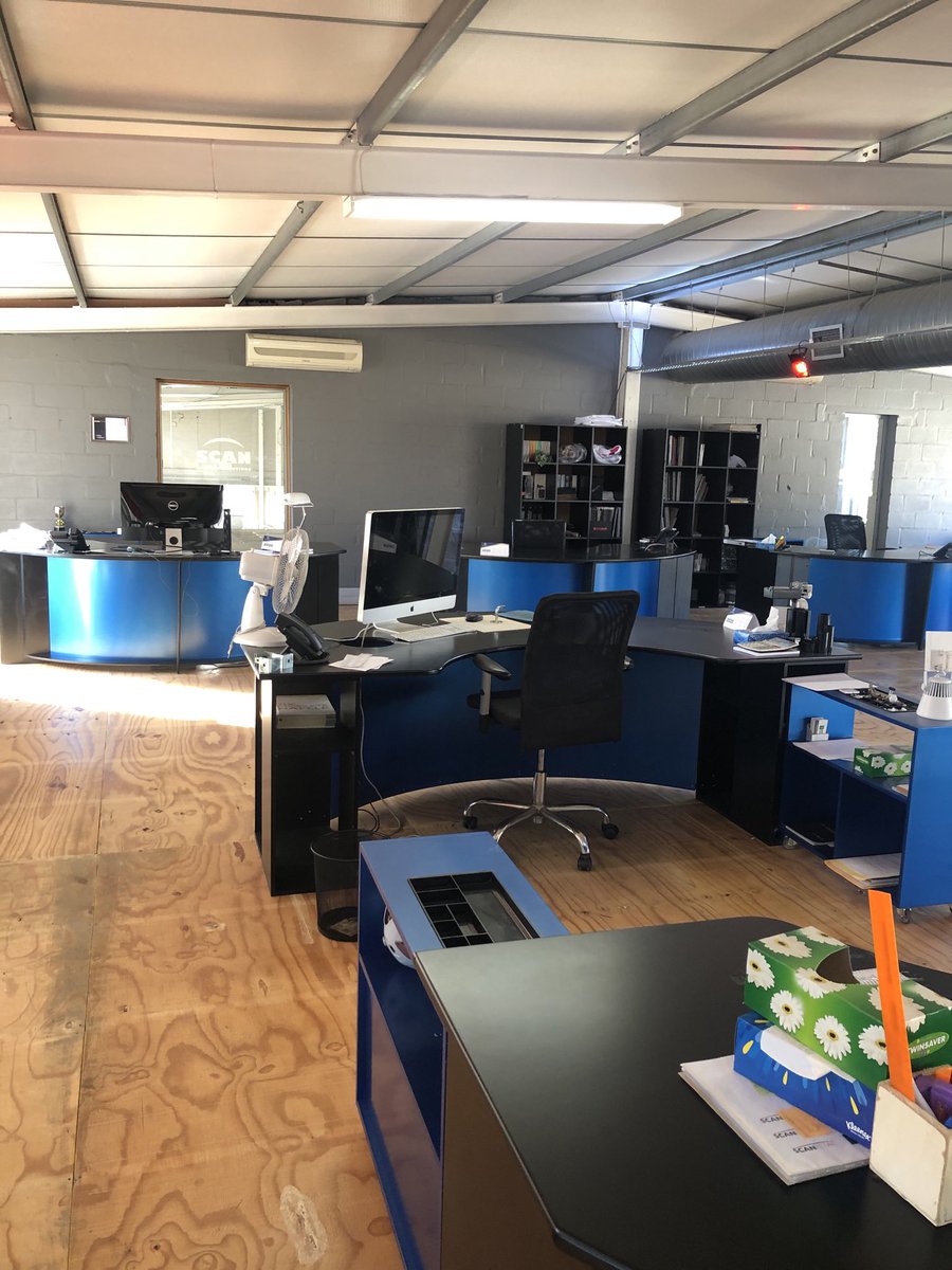 janegsteel's tweet photo. A sea of empty desks shows the economic devastation of lockdown on the exhibition and event industry #lightSAred is our campaign to put our industry in the spotlight and push for open up dates #Scandisplay #eventsindustry https://t.co/cQZ6w67Uih