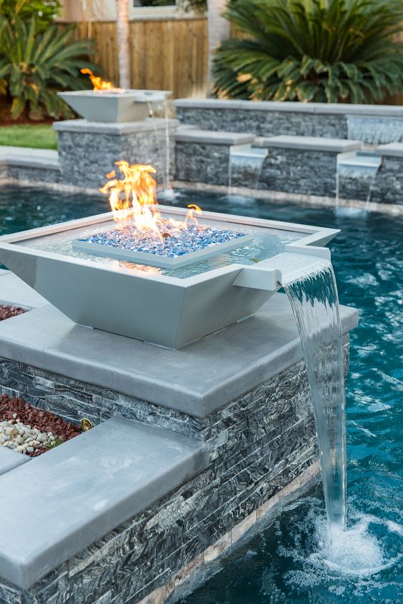 LandscapeEvent's tweet photo. Geometric pool with columns adorned with black ledger panel and natural looking pool tile.
#WaterfeatureWednesday https://t.co/zJesHNIw1D