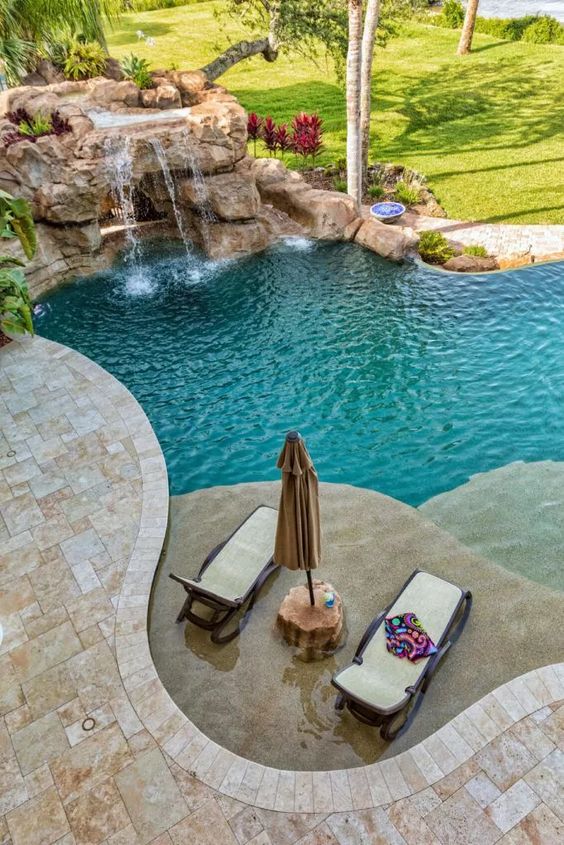 LandscapeEvent's tweet photo. Beautiful pool with integrated waterfall
#WaterfeatureWednesday #pool #decking #patio #waterfall https://t.co/hvpSFvTd1g