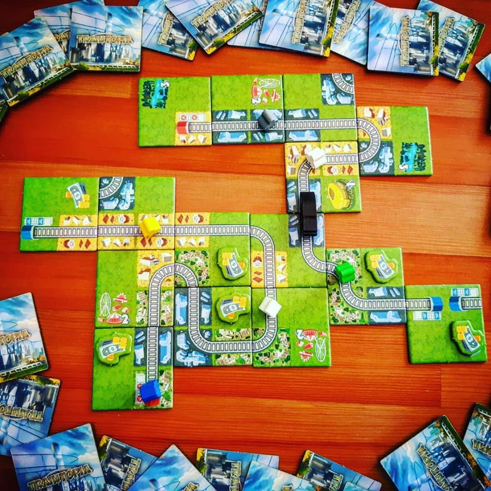 BoardAndDice's tweet photo. Traintopia: a game about carefully building a meeple pyramid and then tipping it over, frantically looking for the right track, and fighting your cat for that precious tile.
#boardgame #train #traintopia #cat #meeple #boardgamepics #stayhome #playgames #allthatworkfornothing https://t.co/39s4HY5cC2