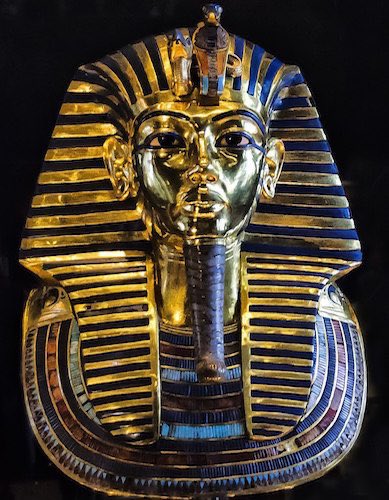 The Nemes is not a crown, but rather a striped headcloth that covered the whole head, sometimes extending a little way down the back. The earliest depiction of the nemes is the ivory label of Den, I Dynasty. In addition to the ureas, was sometimes combined with the double crown.