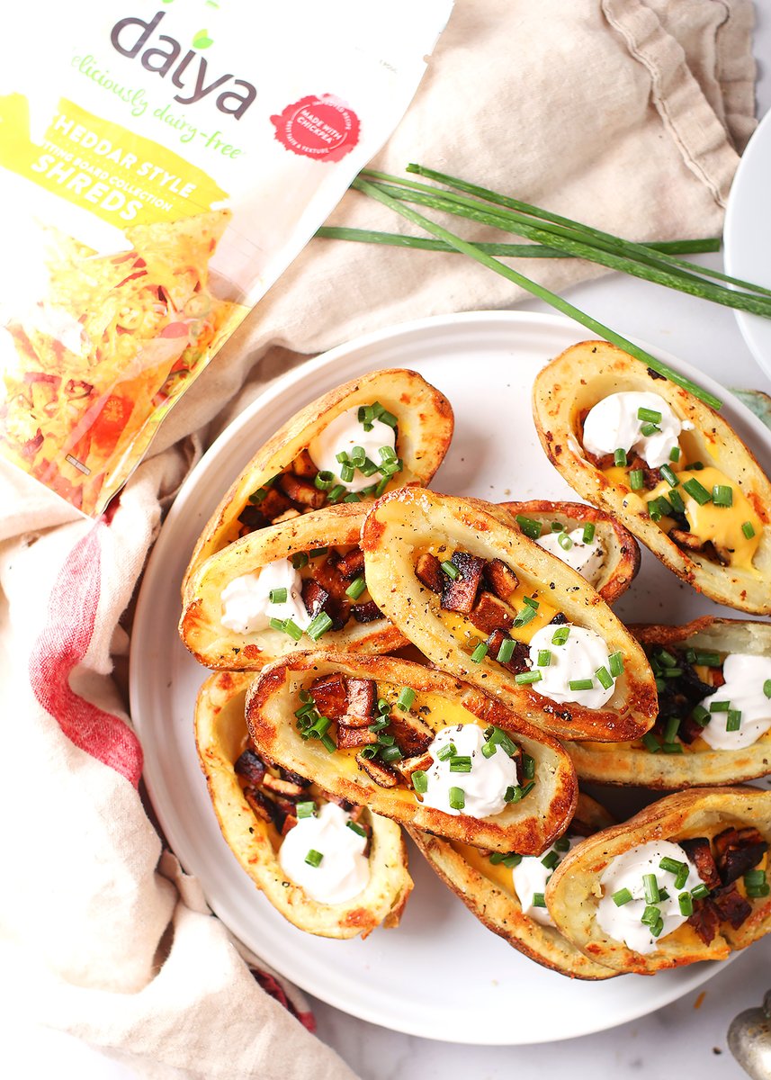 Make your summer grill outs special with these Grilled Vegan "Cheddar and Bacon" Potato Skins. #ad They are lightly grilled potatoes filled with a melty cheese sauce made from @daiyafoods  Cutting Board Cheddar Shreds and topped with tofu bacon. So good! 

mydarlingvegan.com/vegan-potato-s…