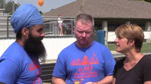 Miraculously, Brian Murphy survived (below, center). He still has two bullets in him.A year after the shooting, a survivor pointed out to Murphy that there had been 15 people still hiding in the temple who could have been killed by Page. Murphy took a bullet for each of them.