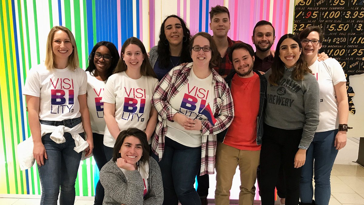 Group of people wearing a shirt that says "Visibility"