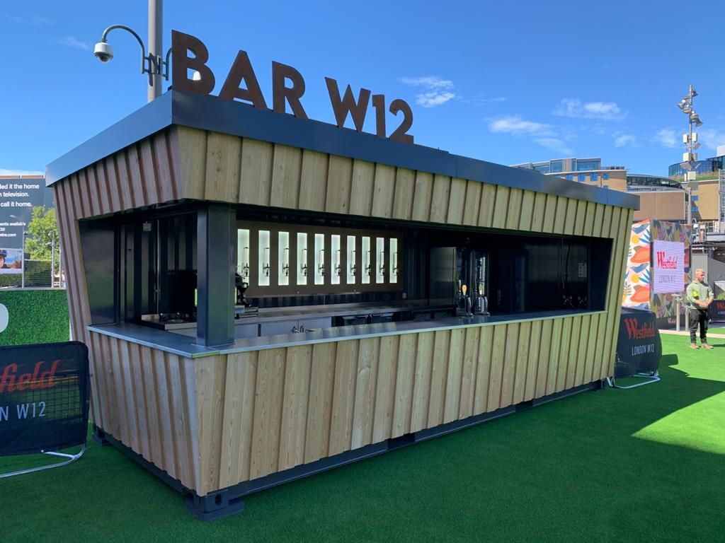 truestagingltd's tweet photo. Great to see our container bar conversion for @WestfieldLondon in place. OPEN NOW. Bar W12 is a new destination for eating, drinking and outdoor film at Westfield Square. Wiring and testing by @The_Tech_Dept https://t.co/bwdhTcw9L4