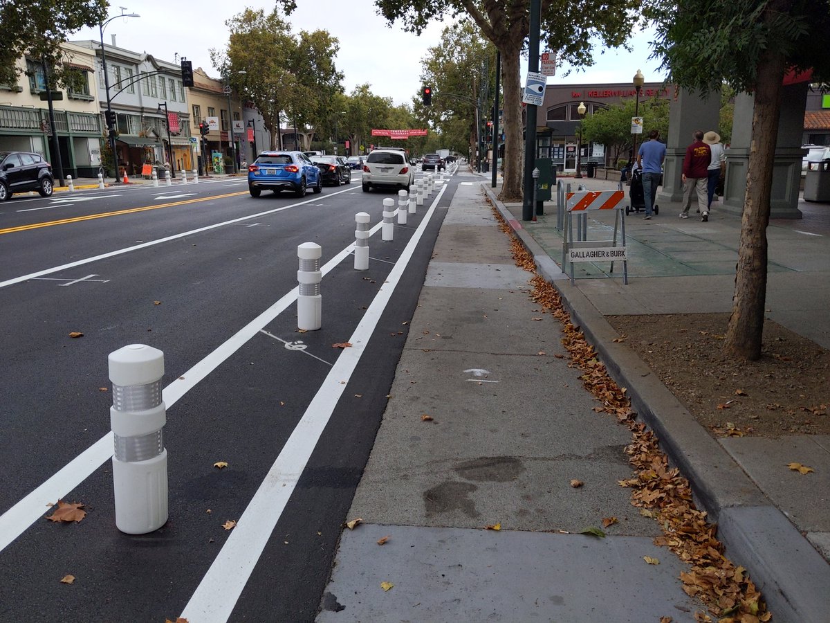 The next segment of protected bike lanes on Telegraph has gotten it's bollards. Still needs green paint. But I can measure the width: 7'3", slightly too wide. Maybe it'll be ok.