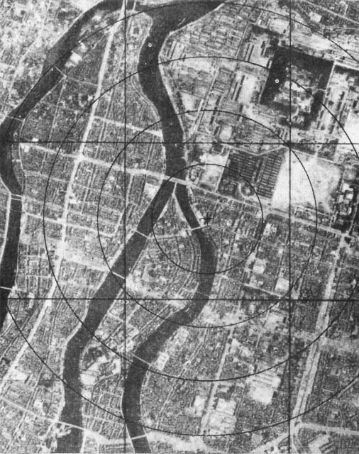T-6 minutes. Ferebee takes control of the plane. The Enola Gay has begun its bombing run. Only Ferebee, Tibbets and Parsons know what the bomb can do: everyone else has been given black goggles and told to expect a flash.This is what Hiroshima looks like from the air.