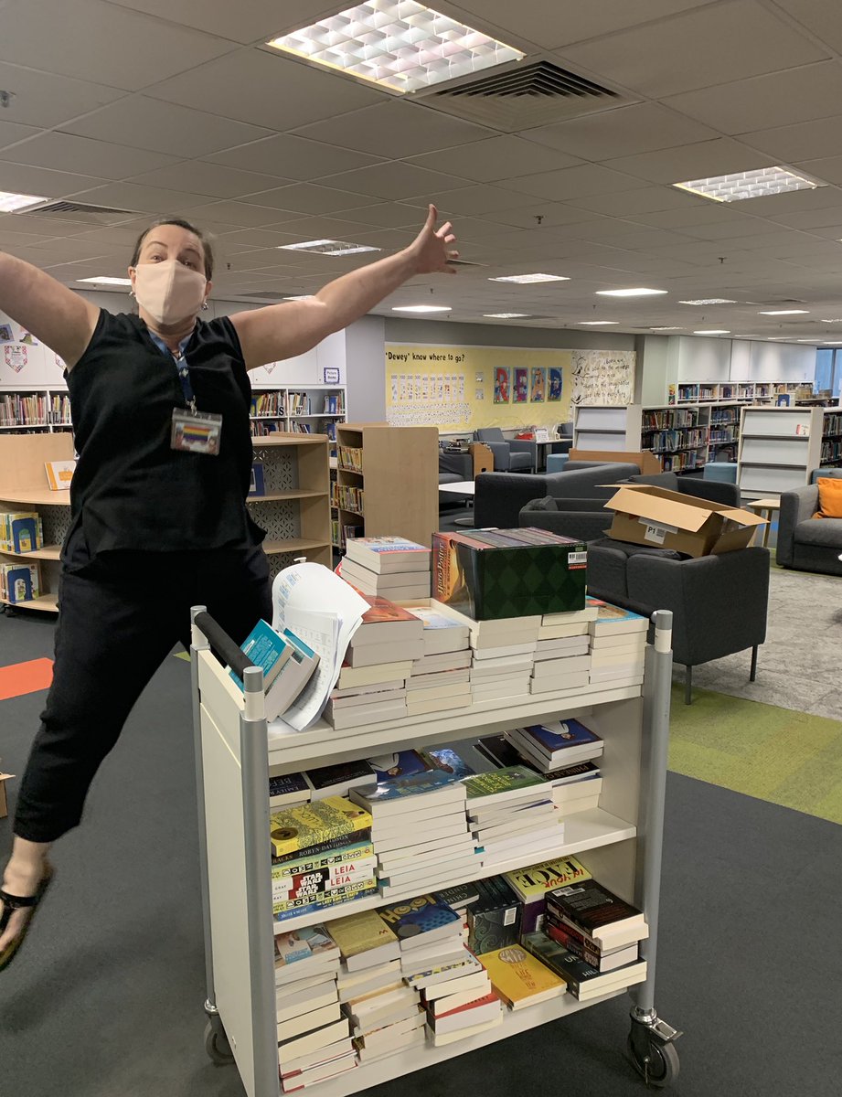 kmelski's tweet photo. @SaraKThompson is jumping for joy because the amazing new books ordered for the SY Satellite Library @GEMS_Singapore have arrived!! #gemsreads https://t.co/46v5kfU6F4