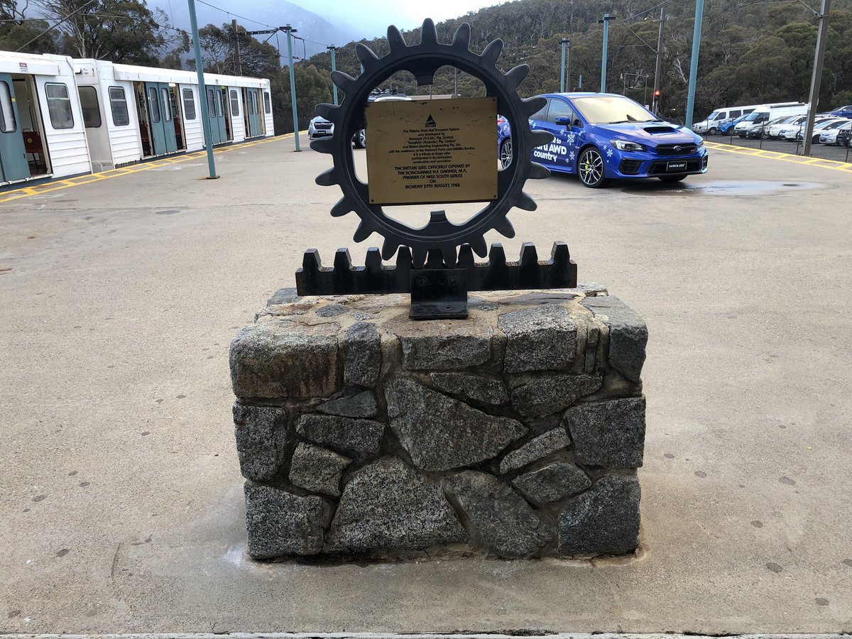 The opening plaque is on the platform at Bullocks Flat incorporating a model of the rack and pinion system. On the back is a diagram of the railway and all sorts of technical details about Skitube.