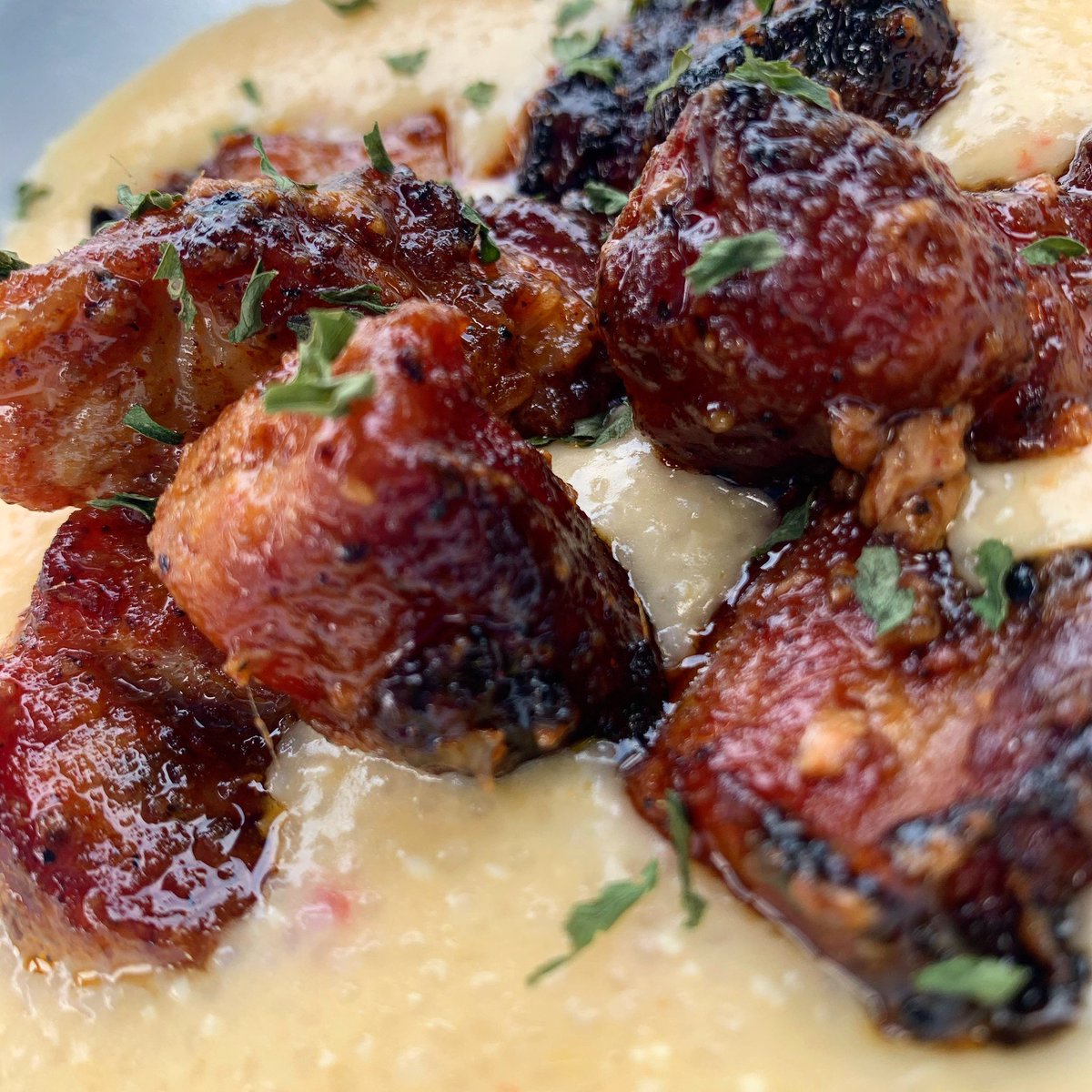 charliesnooga's tweet photo. Lemongrass sesame smoked pork belly over pimento cheese grits. A little bbq fusion going on this week! Come get our special through Saturday! #charlieschattanooga #chattanooga #porkbelly #porkbellyburntends https://t.co/fZE3mXWdLS