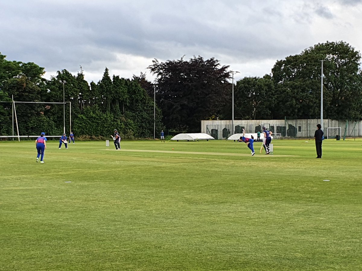 Gaby Lewis and Sarah Forbes opening the batting for YMCA, Anna Kirk and Emma Butler bowling for Clontarf