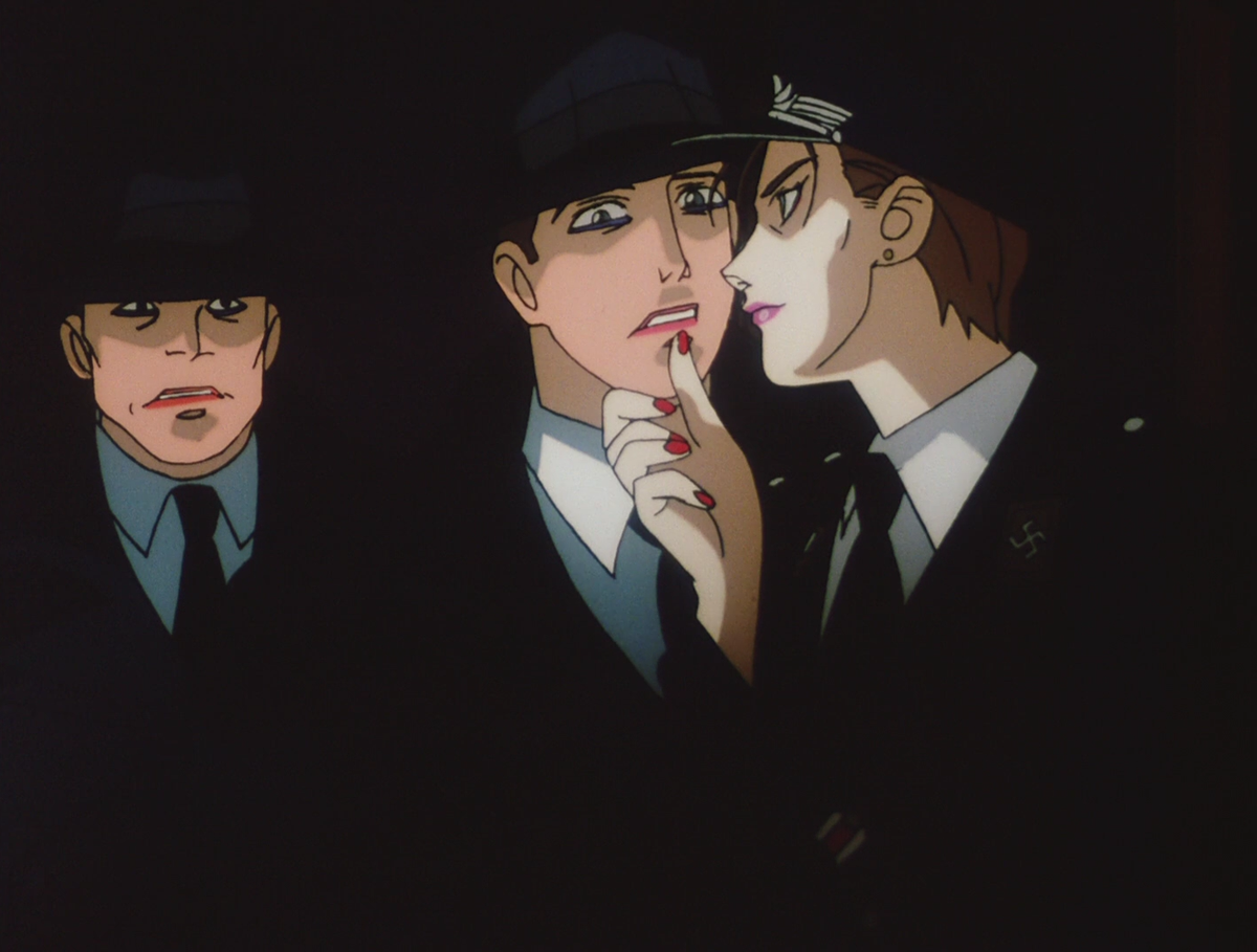 First, the main villain in this special is a homophobic, okama-type crossdressing stereotype. One who speaks with a feminine voice, wears lipstick, and doesn't like to be near women. On top of this, he is the leader of a neo-nazi cult.