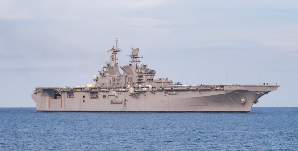 USNavy's tweet photo. #USSTripoli (LHA 7), the second America-class amphibious assault ship, pulls into Naval Station #GuantanamoBay while en route to her homeport in #SanDiego. Naval Station Guantanamo Bay is the forward, ready, irreplaceable U.S. sea power platform in the Caribbean. https://t.co/mRMrTptWOb