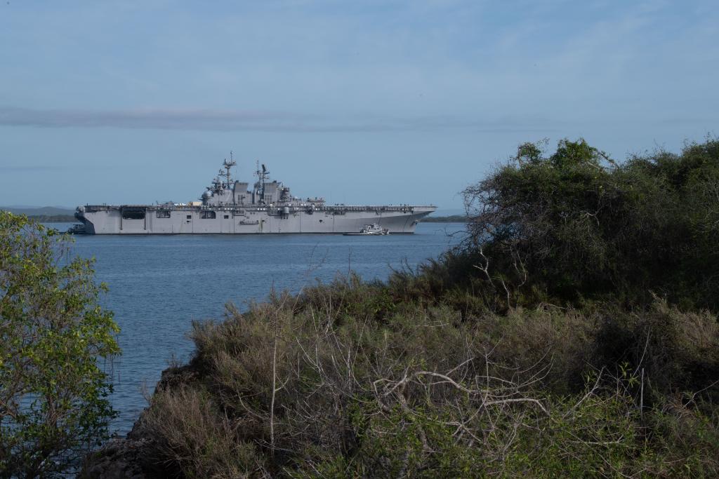 USNavy's tweet photo. #USSTripoli (LHA 7), the second America-class amphibious assault ship, pulls into Naval Station #GuantanamoBay while en route to her homeport in #SanDiego. Naval Station Guantanamo Bay is the forward, ready, irreplaceable U.S. sea power platform in the Caribbean. https://t.co/mRMrTptWOb