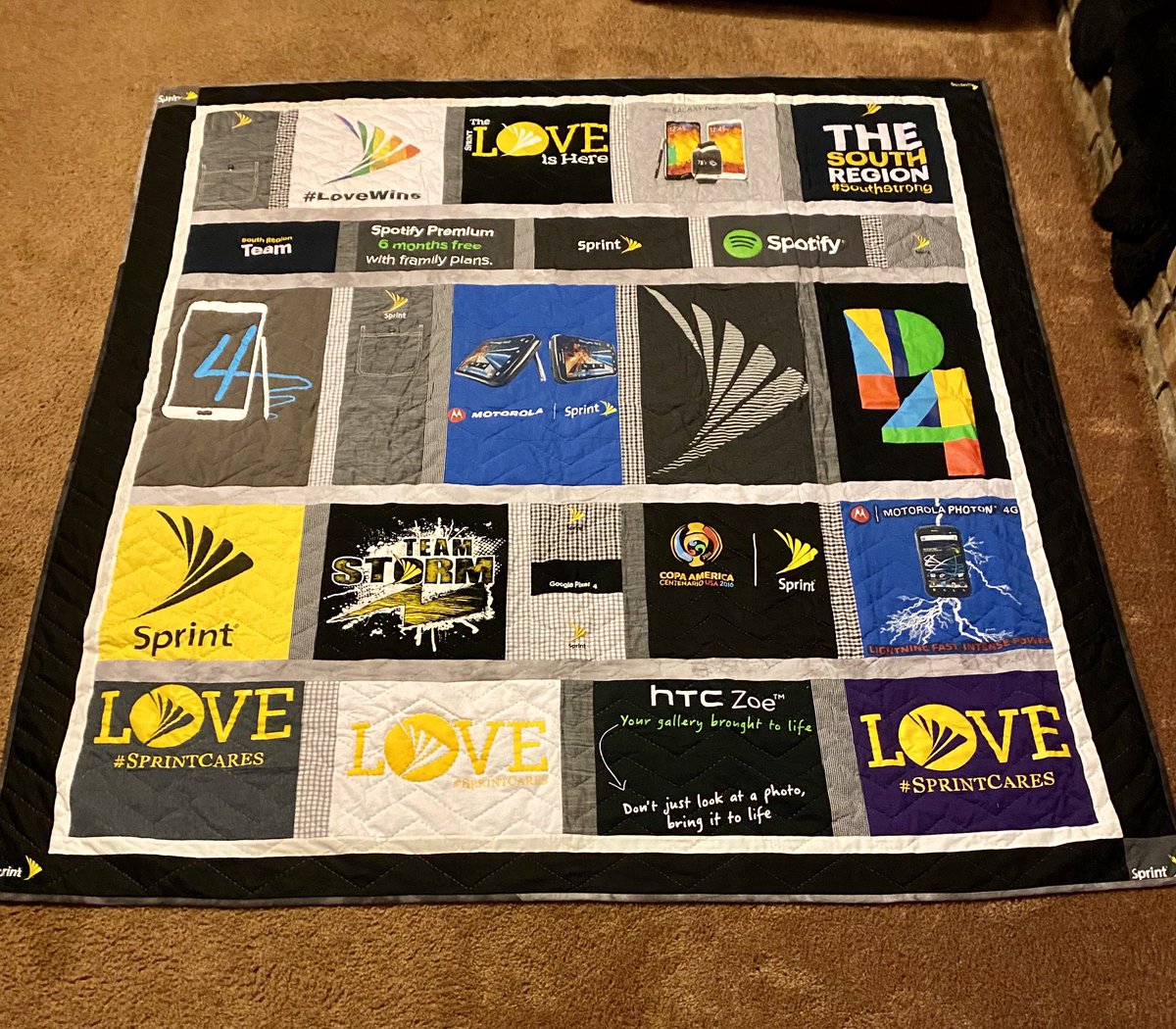 Got my beautiful Sprint t-shirt quilt in the mail today!! I’m so in ♥️ with it! 20 years @ Sprint culminated in one gorgeous blanket. My favorite t-shirts plus dress shirts used for the sashings! 😍