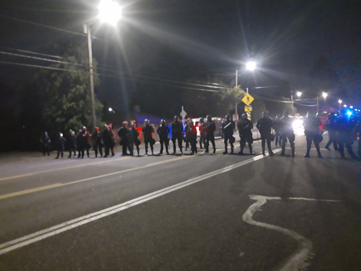 Protesters tell the cops to stop blocking traffic
