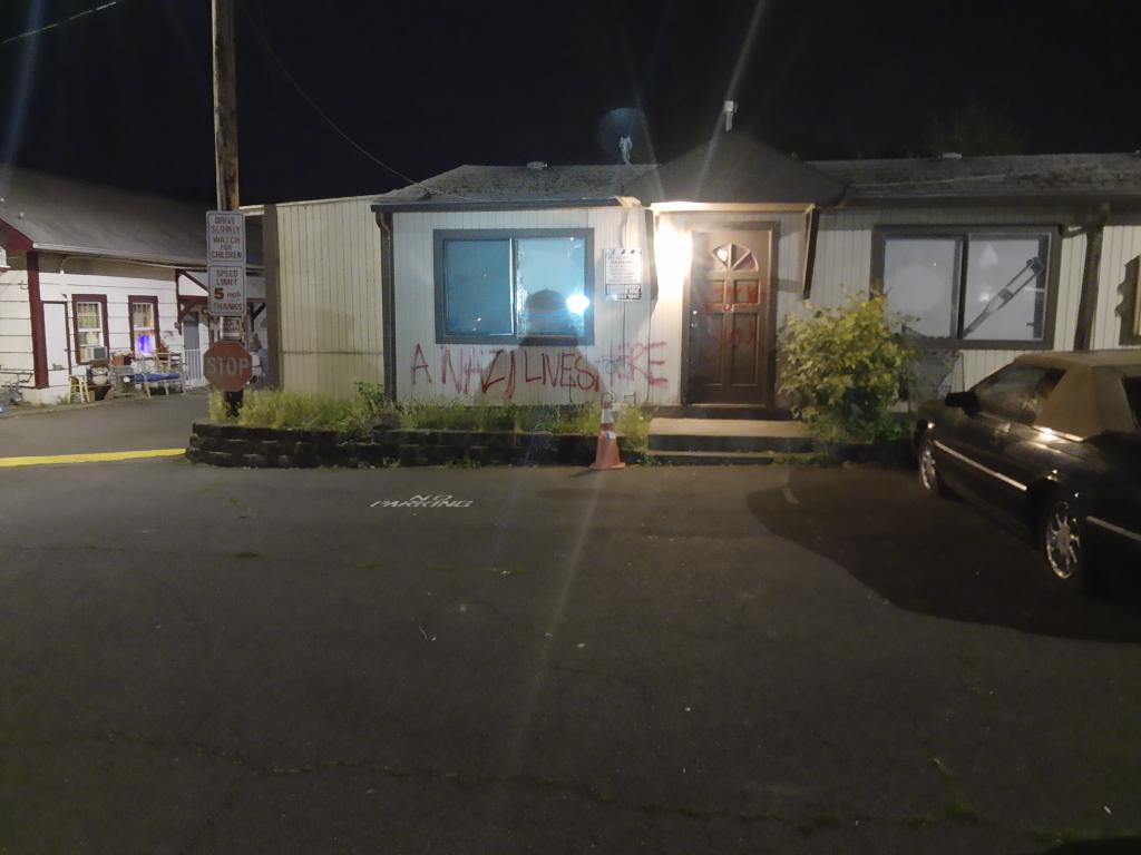 Back at that Nazis house from. Last nightA protester breaks her window. No sign of life in there"Let's go!" someone yells. Seems like a good plan