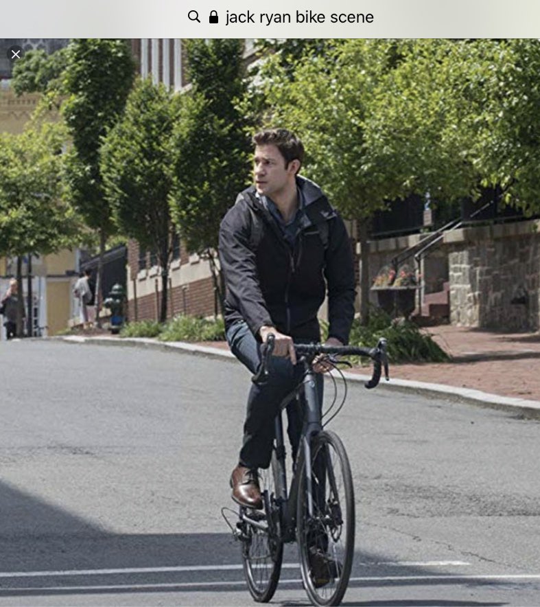 Jack Ryan: He makes cycling look sexy on his way to work, but is nearly killed by his (spoiler) not-yet-known boss in a sports car. Biking is used to show you his risk-tolerant edgy side. He is the exception not the rule in his bureaucratic desk job.