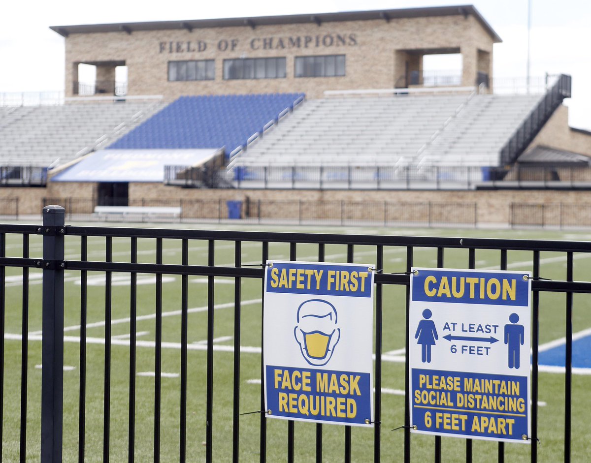 A sign of the times at Piedmont High School with caution signs placed around the Field of Champions.