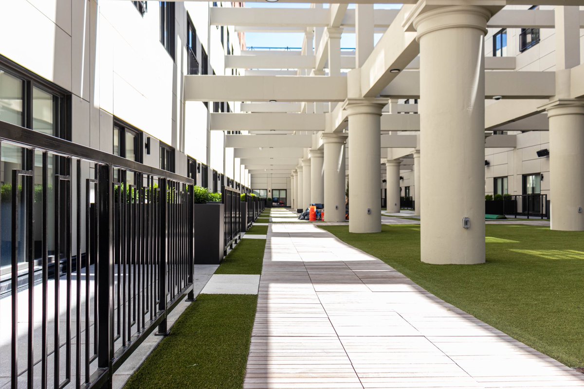 A number of units face directly into the atrium, and many include private balconies and patios.