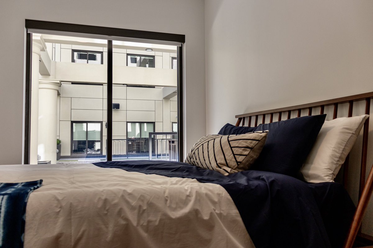 A number of units face directly into the atrium, and many include private balconies and patios.