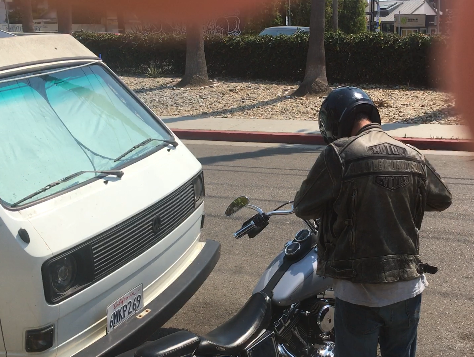 Here's hipster bully who leaves motorcycle on for 10 mins while he sits in van, forcing all on my block to suffer his abuse. Class act. Only words to me: "Show me your tits." @LAPDHQ toothless to make him/GF stop "camping" on my street bc pols paused codes they use to enforce.