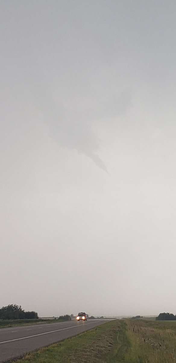 Persistent funnel cloud on tornado warned storm over Binscarth, MB #mbstorm