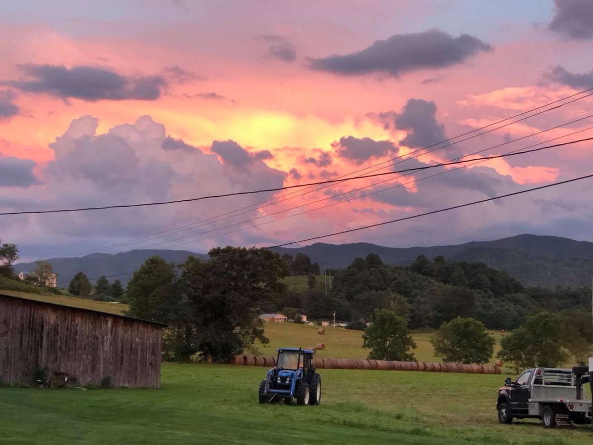 Beautiful sunset in the mountains of Tennessee, Hay is all rolled to feed the cattle this winter. Gods masterpiece, even Monet can`t compare to his works!