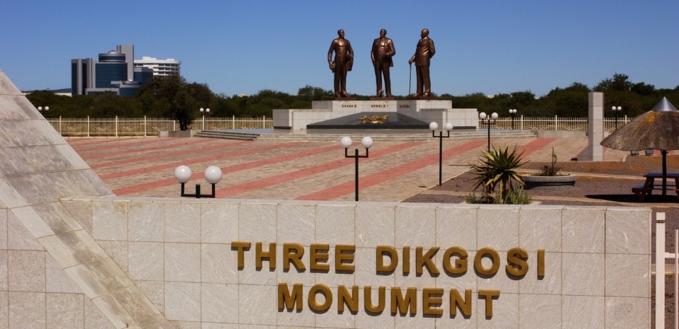 We're visiting the capital of Botswana tonight to see the Three Dikgosi Monument. It has three 18 ft tall (5.4 meters) bronze statues of three dikgosi (chiefs) who were important to the independence of Botswana.