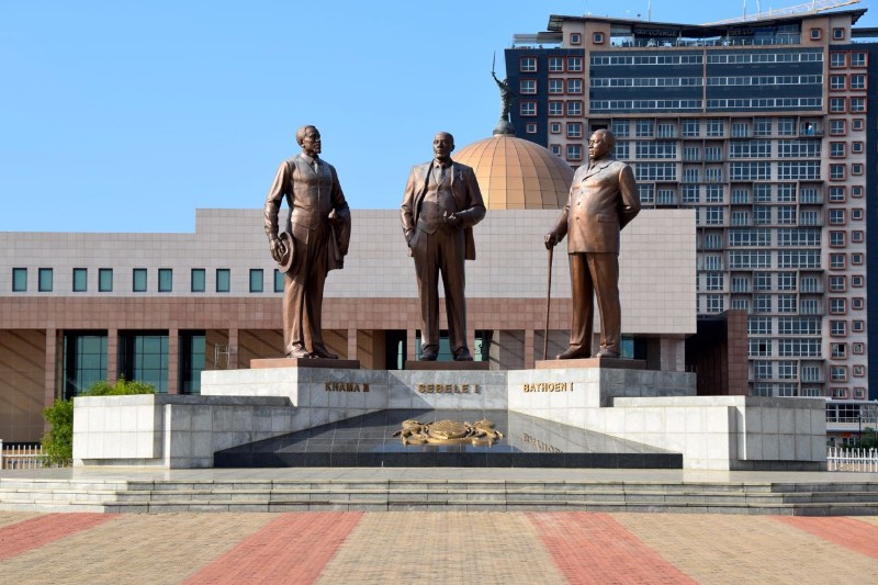 We're visiting the capital of Botswana tonight to see the Three Dikgosi Monument. It has three 18 ft tall (5.4 meters) bronze statues of three dikgosi (chiefs) who were important to the independence of Botswana.