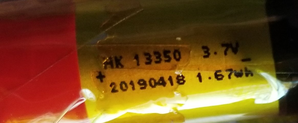 Speaking of the battery, it says HK 13350. That's a cylindrical lithium-ion battery, and "13350" means it's 50mm long, and 13.3mm in diameter.3.7V, and 1.67 watt-hours. (which'd be 451 mAh)
