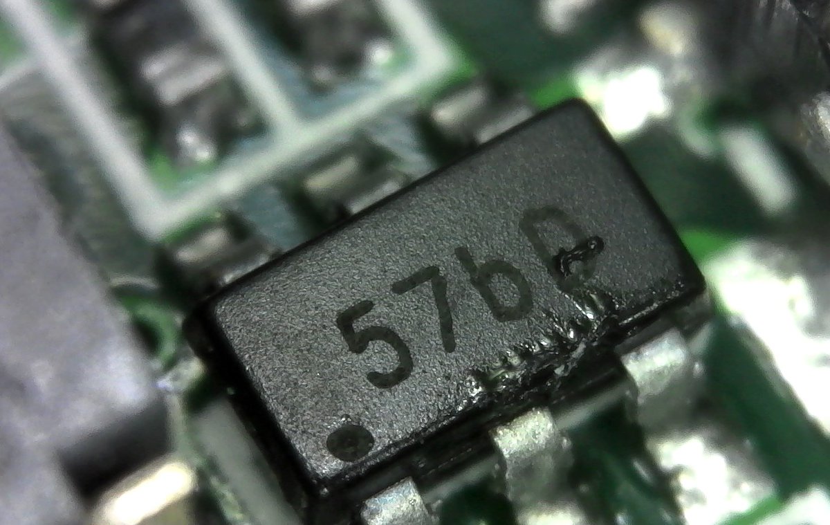 This other 6-pin IC is a 57bD. I can't be sure, but there's a couple dual-transistors in that package with similar names, so probably a transistor.A grimy one. ewwww