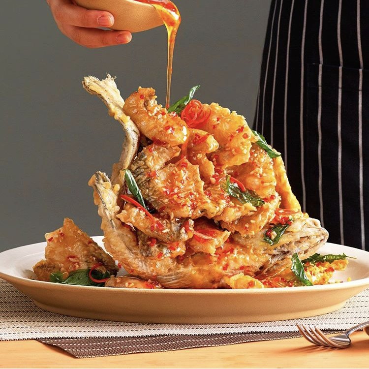 This is our famous Seabass dish. Ever so lightly battered and glazed with either sweet chilli or lemongrass. And you can now get 50% off your bill with the #EatOutToHelpOut campaign.