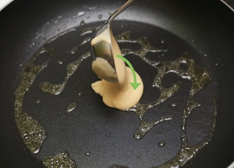 Step 3: Ladle on the pancake batter in small circles. Cook the pancakes until they begin to bubble.