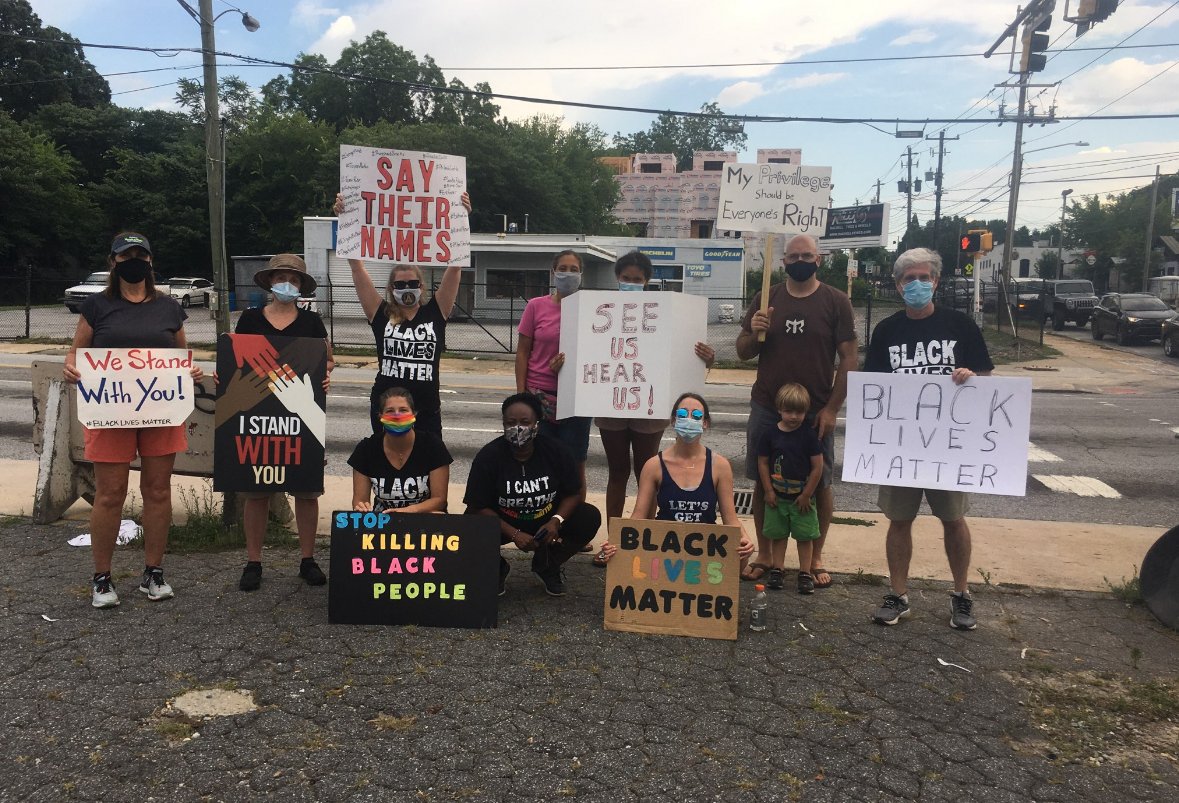 Protesters holding signs in Atlanta