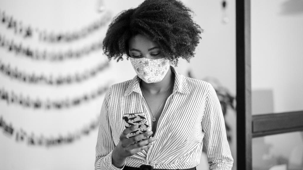 woman on dino phone in mask