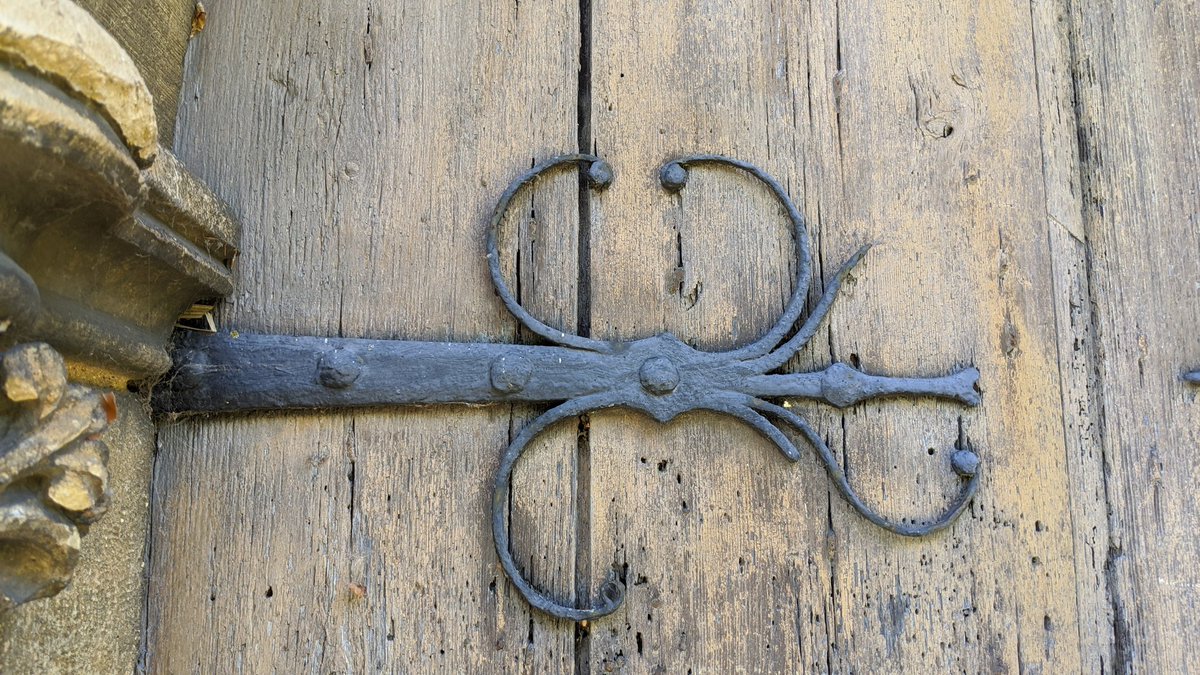 Heading back outside, I stopped to admire the door (and the graffiti) - the wood of the door is new(ish) but the hinges are the original ironwork from the 1200's.