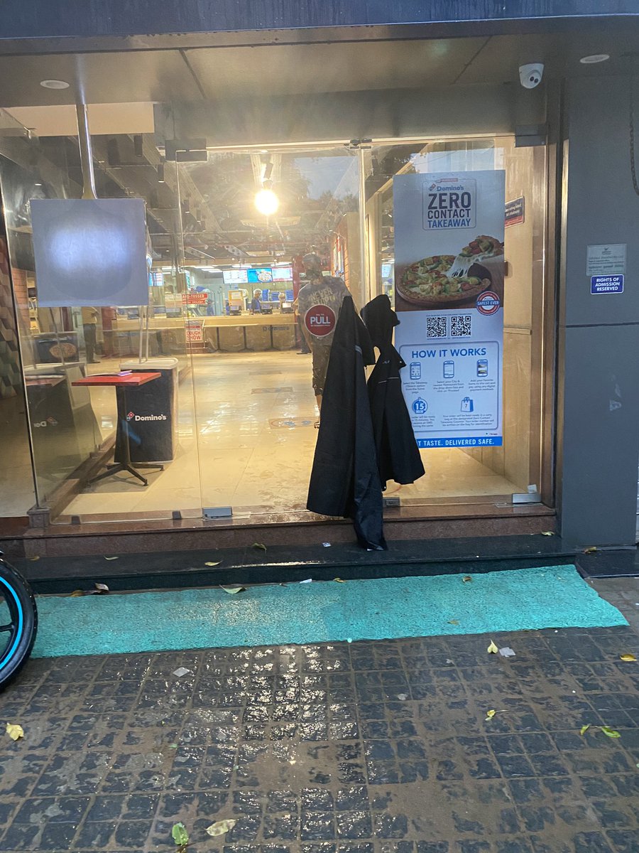 Event_Schemer's tweet image. This domino’s store in ranchi, jharkhand near sujata chowk, Has no person to check the temperature, there is not even a sanitizer at the door.
The staff is not wearing gloves and the  delivery guys are entring the kitchen. 
Is #dominos safe?
@dominos_india
