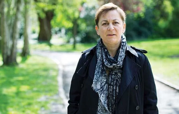 Here's Anne Enright. Sebastian Barry's former boss. She meets him in a park to talk him out of his obsession. She'll say things like "this is eating you up inside" and "it's not too late to stop." Sebastian appreciates her friendship and kindly wisdom.But he won't listen to her.