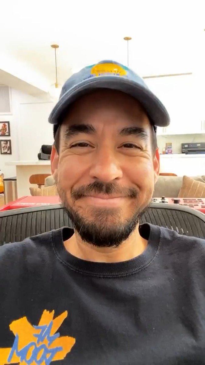 He smiles and closes his eyes, it's cute as fuck! 