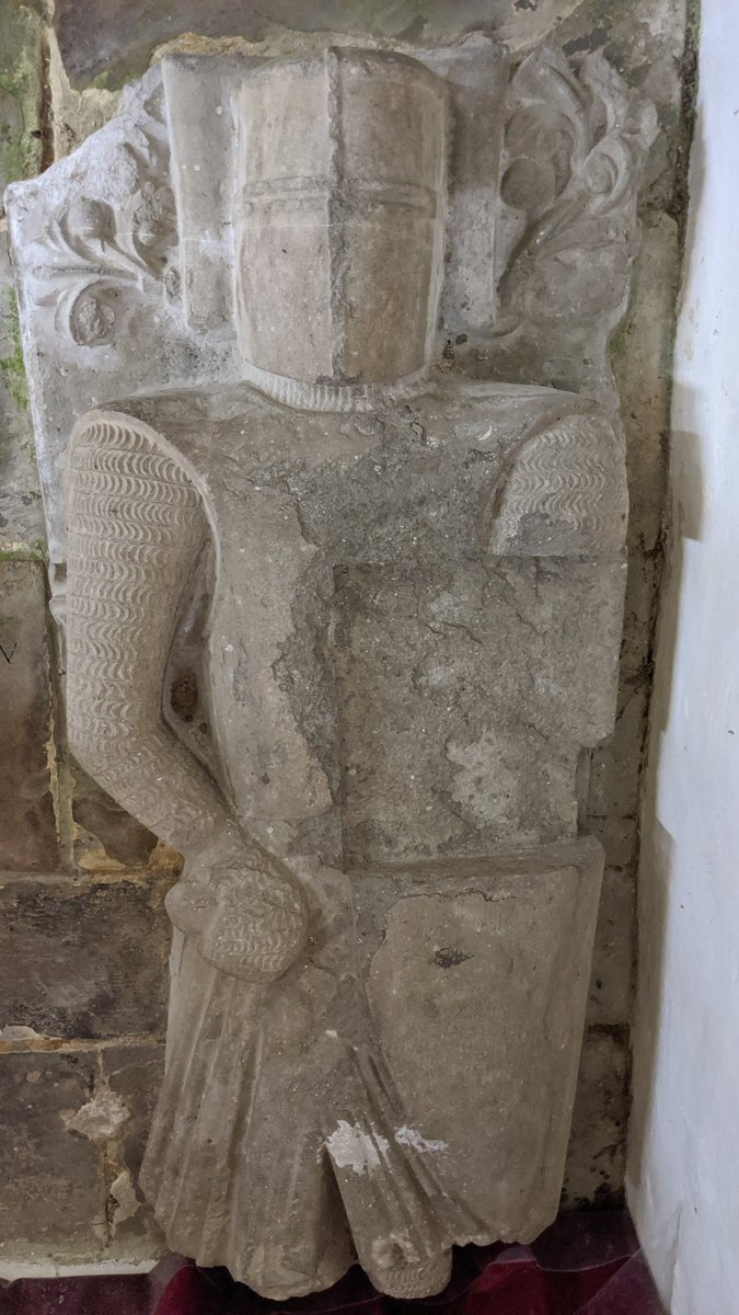 Over beside the altar is (most of) an effigy of a knight. Believed to be one of the earliest military effigies in England, there's only three others still in existence in England with this style of chain mail, and only seven with this helmet style.