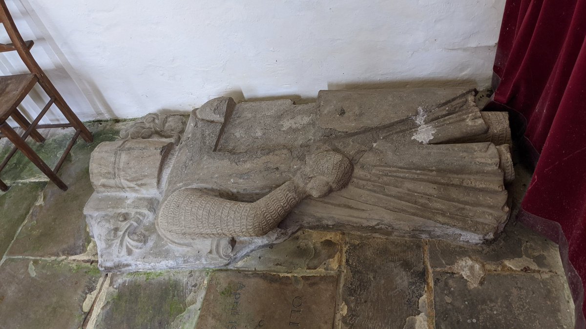 Over beside the altar is (most of) an effigy of a knight. Believed to be one of the earliest military effigies in England, there's only three others still in existence in England with this style of chain mail, and only seven with this helmet style.