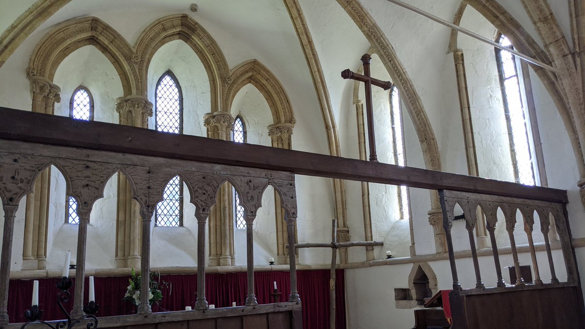 The wooden rood screen that spans the church is unique. The top and bottom sections, in darker wood, date from the 1900's - but the arcading, carved from lighter duller wood, is original to the church, and dates from the 1200's - it's one of the oldest examples in existence.
