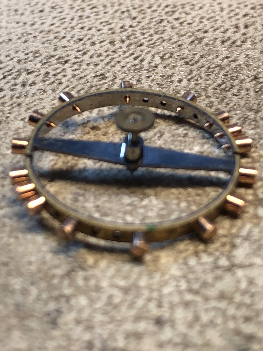 Timebuilder's tweet image. On the horrible messed up pocket watch, fit the lower balance jewel. Now it will go into the lathe to trim the thickness down for proper end shake. This watch is so old, the dial is held in place with small tapered pins rather than screws. 8 more hours it will be done.